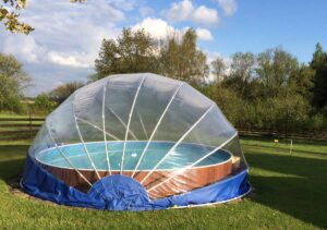 TROPIKO pool roofing for the extended swimming season, a warm pool and azure clean water. For above ground and inground (circular / round) garden pools. Pool cover.